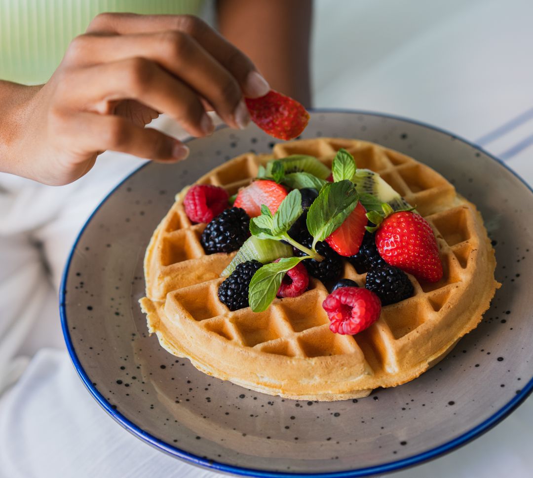 waffle and berries on a plate