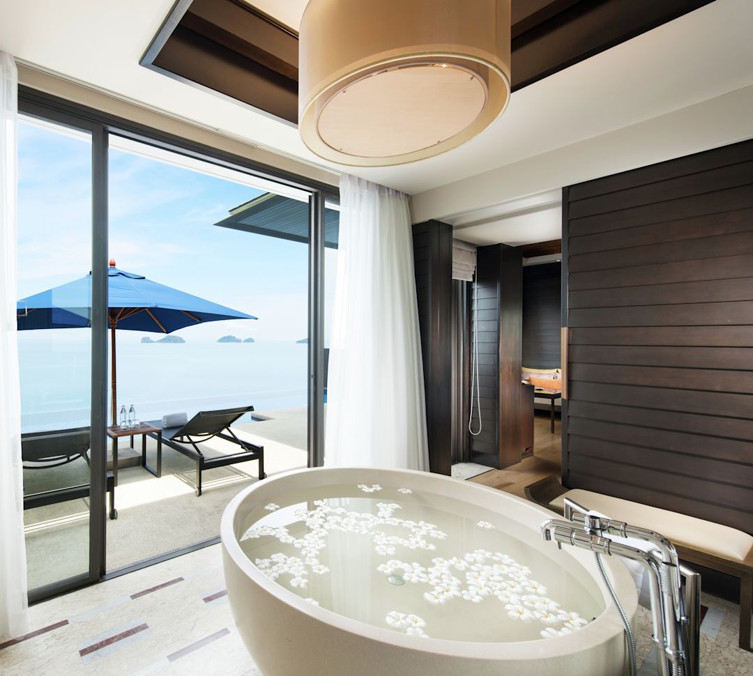 Bathroom with bathub and large window