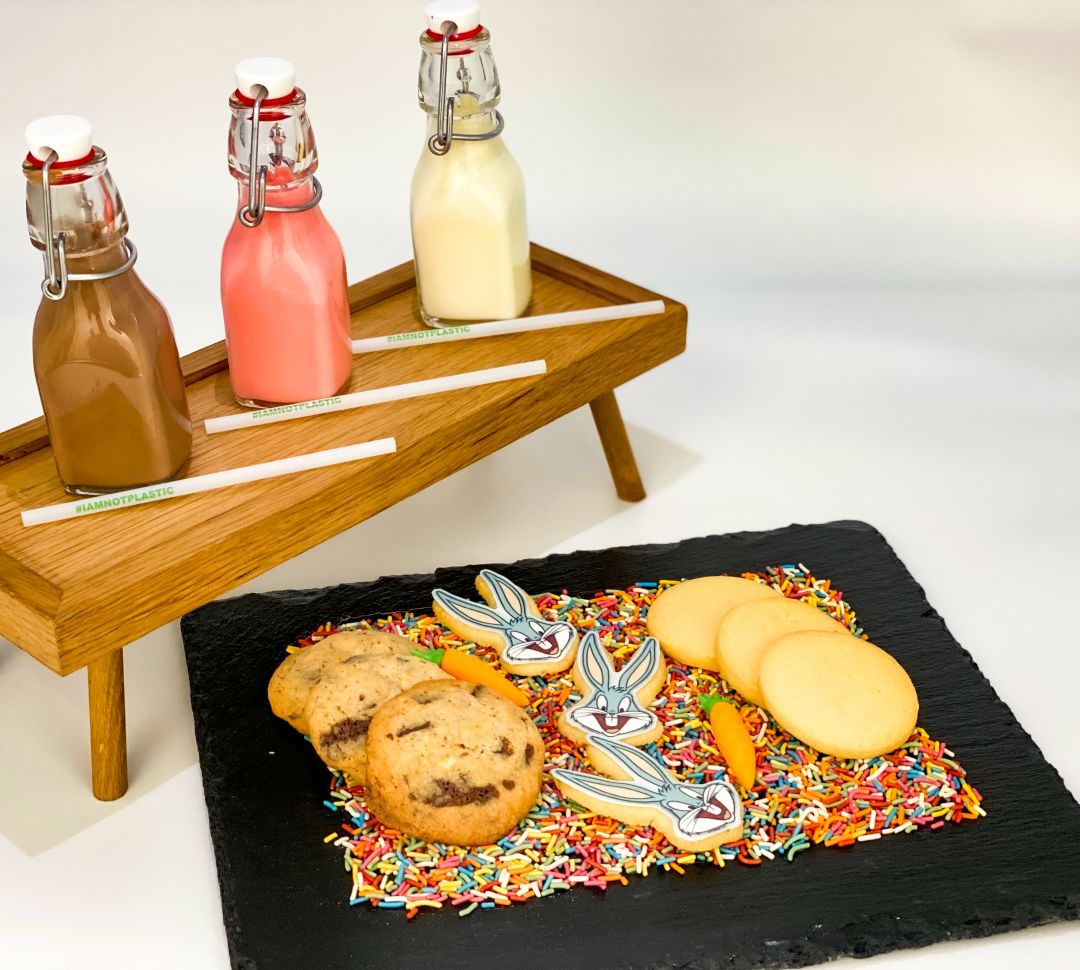 Milk and cookies, with small wooden table and slate