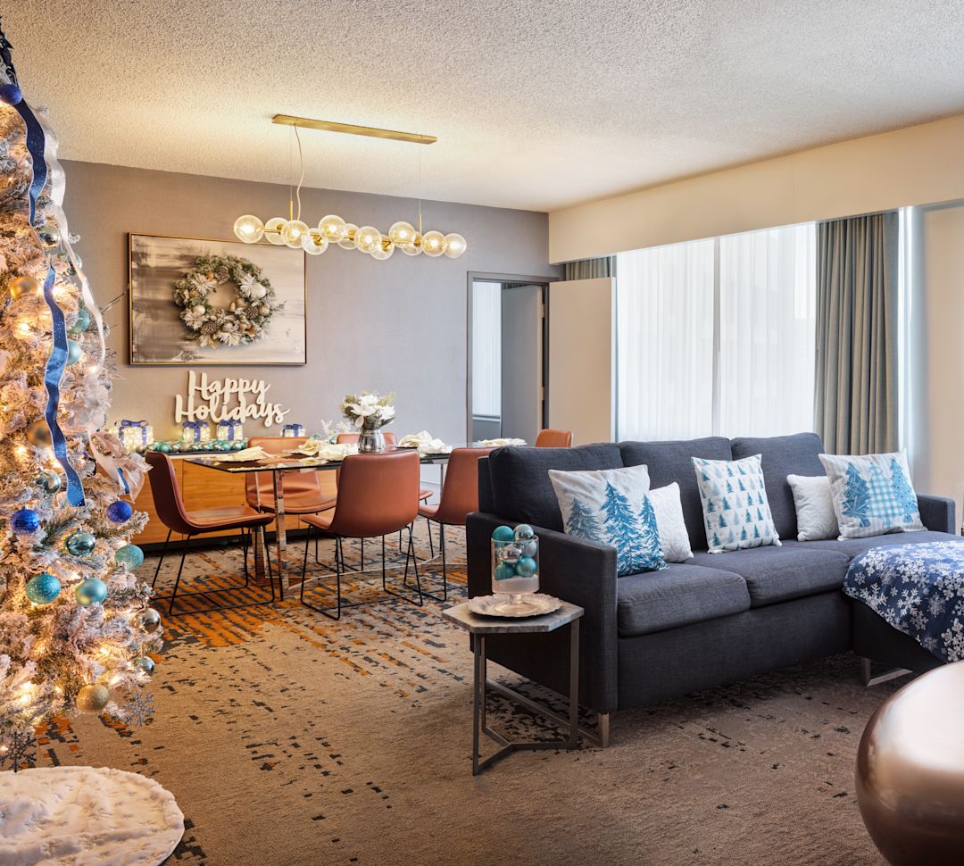 holiday decorated guest suite, lounge area, 2 holiday trees-transition