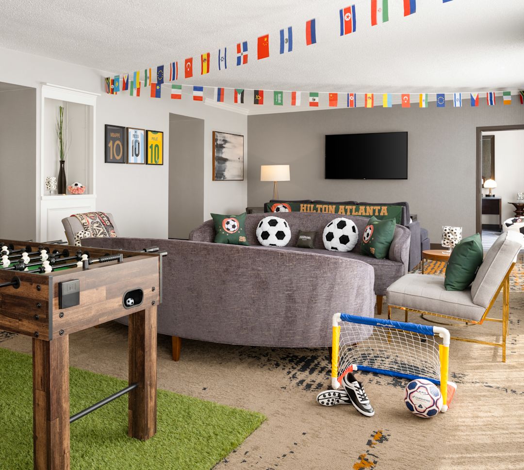 Foosball Table in a Living Room of a Soccer Theme Suite-transition