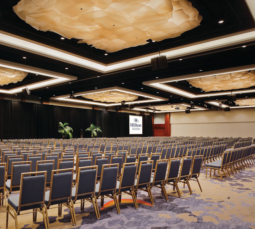 meeting space with rows of chairs for conference