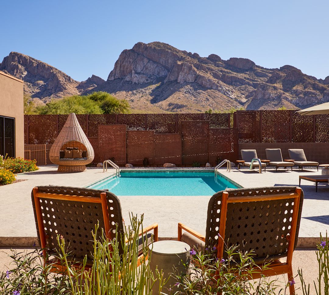 Outdoor Pool with Lounge Chairs and Sitting Area at SpaWell