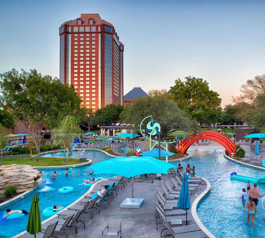jade waters outdoor water park with guests at dusk