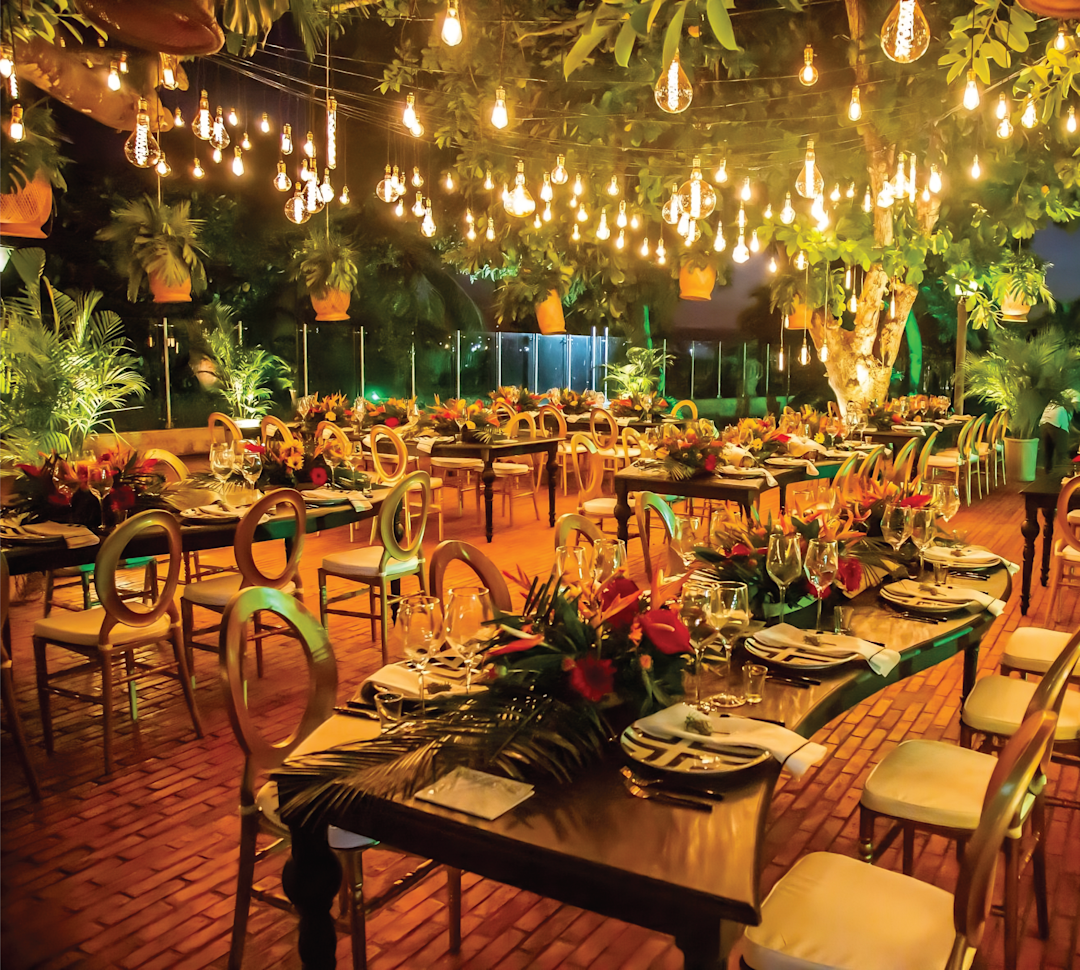Wedding setup with tables, chairs and lighting