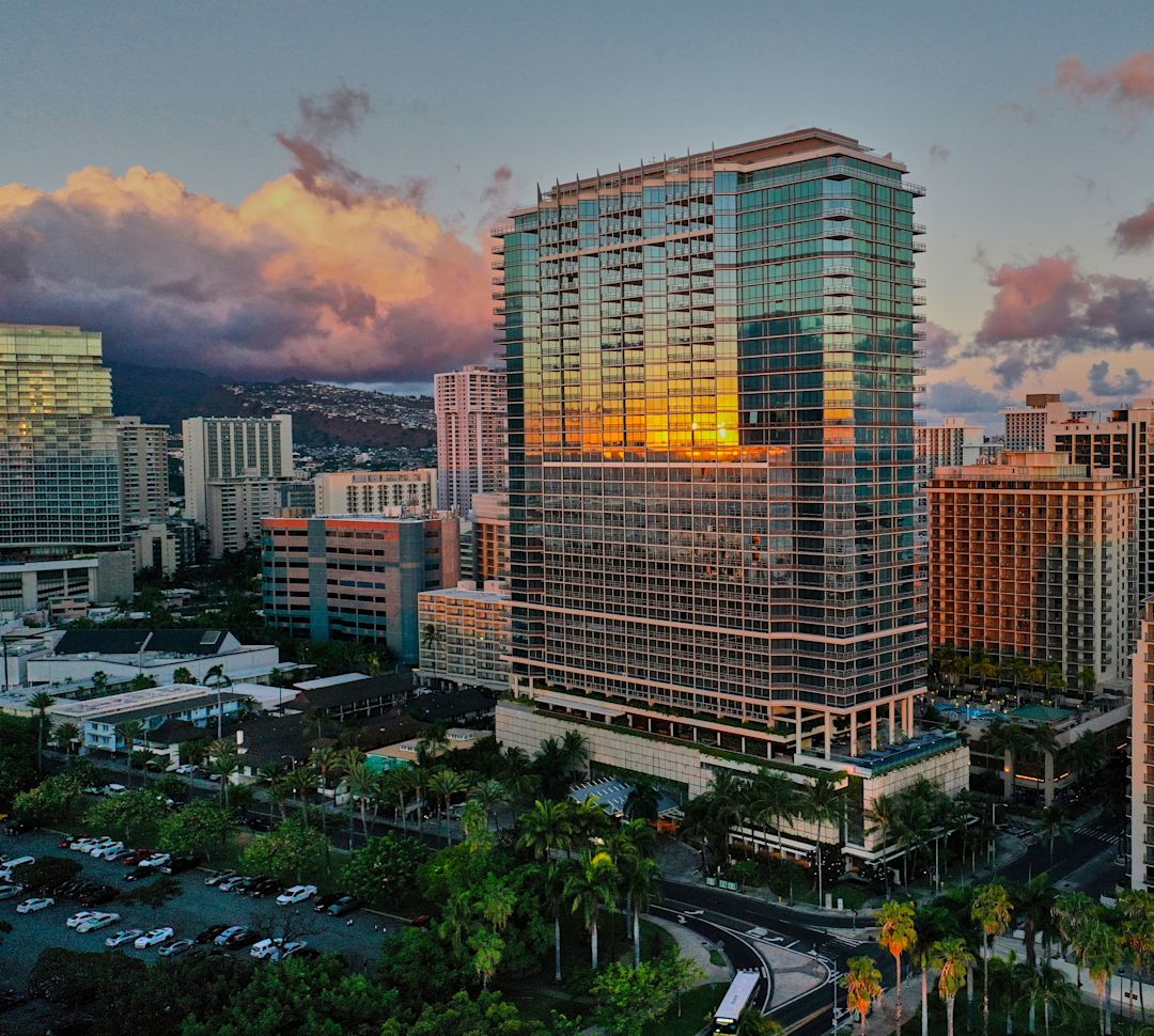 Hotel Exterior in a City at Sunset