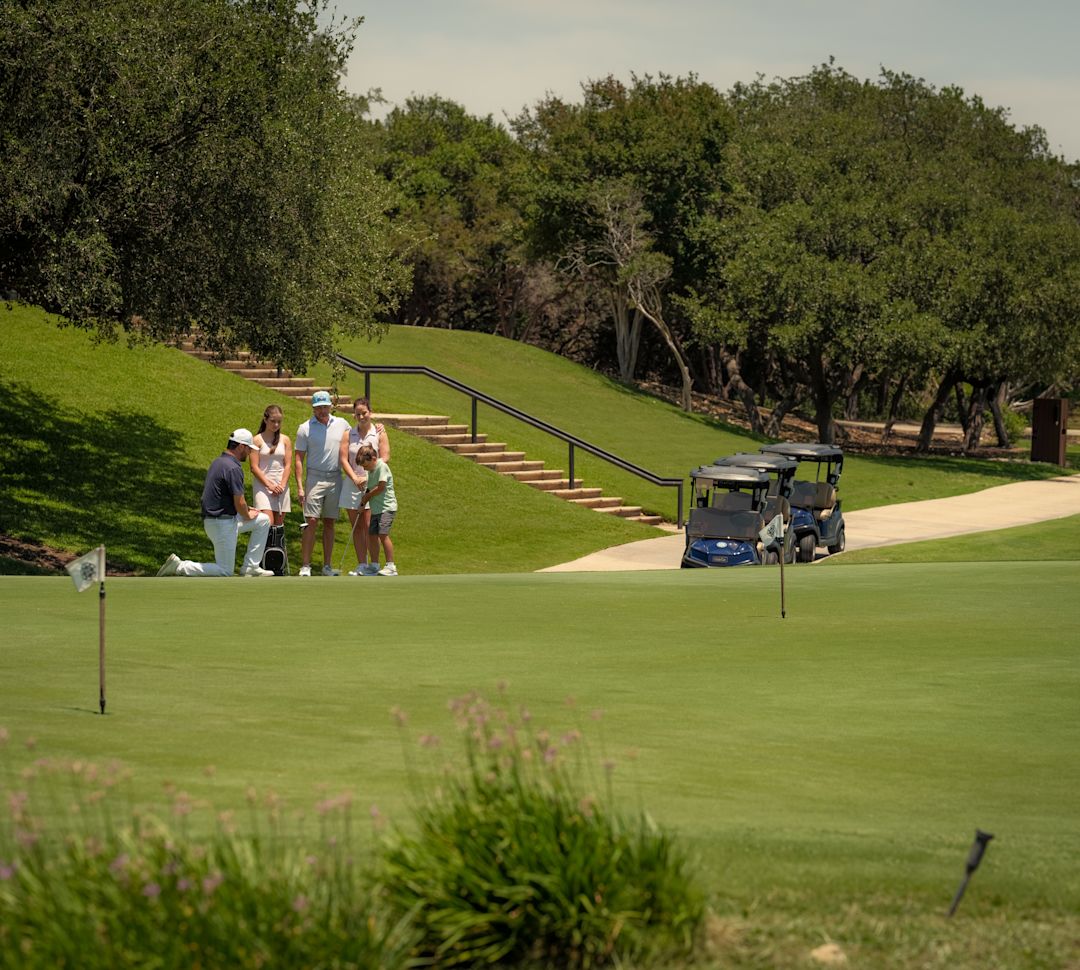Family playing golf