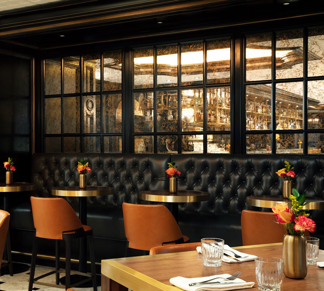 restaurant table with plated food and wine