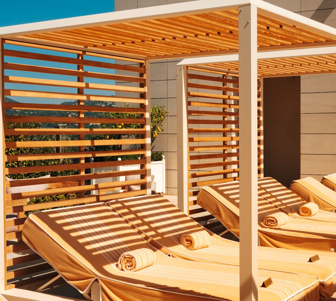 Cabanas with Lounge Chairs in Outdoor Pool Area