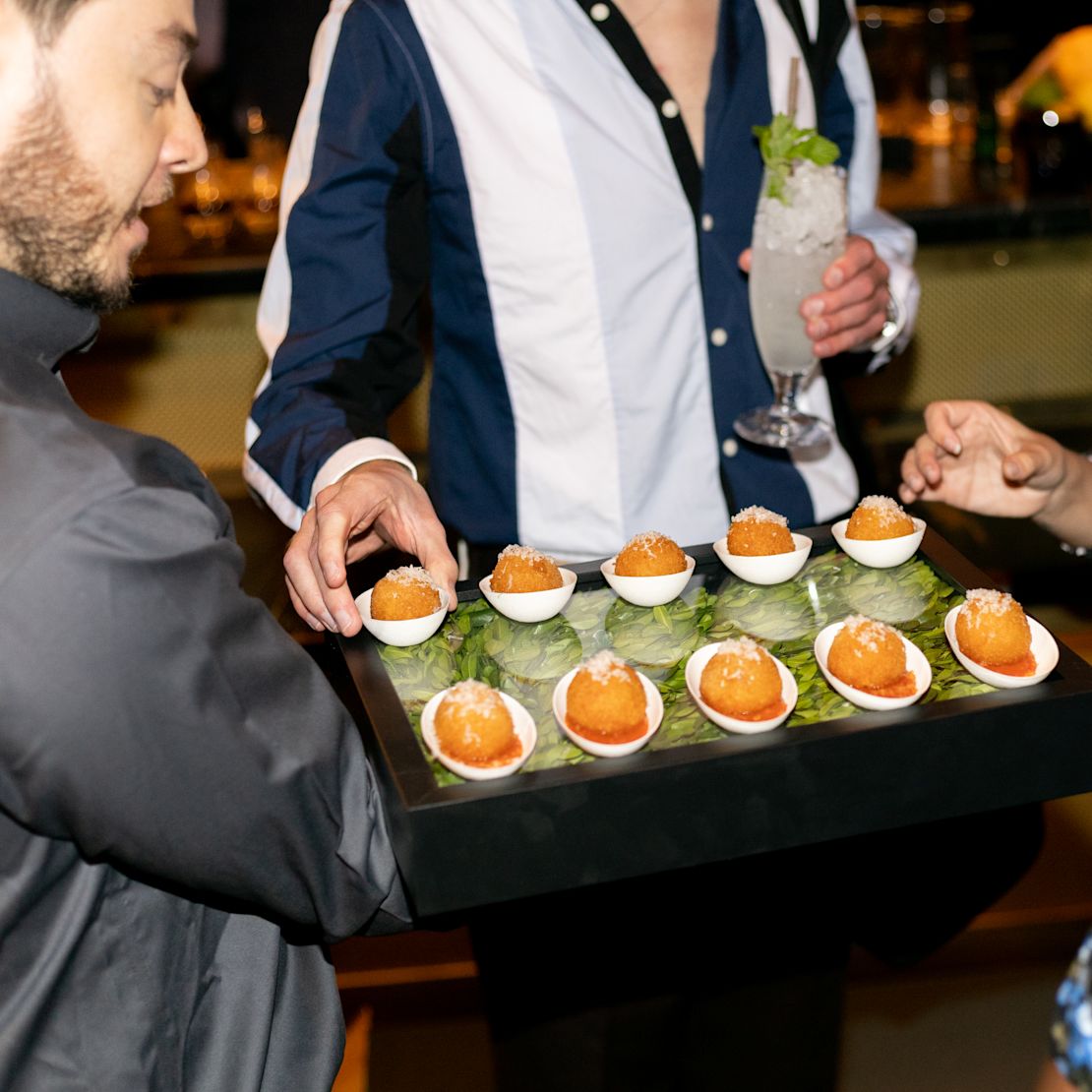 People being served canapes on a tray-transition