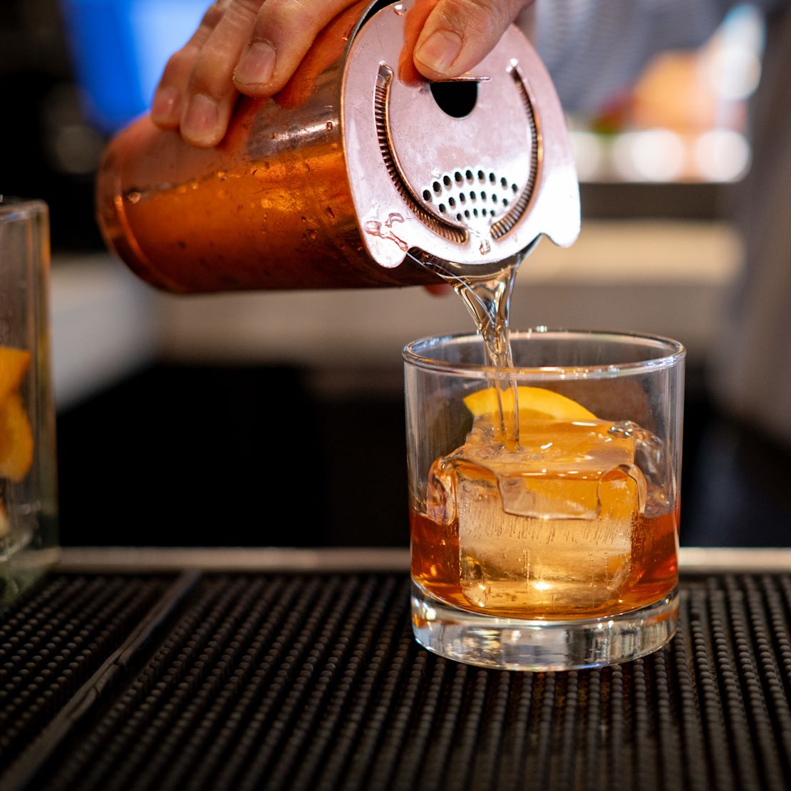 Bartender preparing a drink at the bar-transition