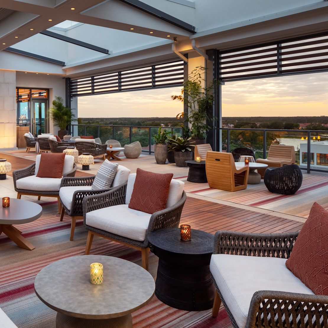 Soft-seating set-up with
  various types of barrel chairs and sofas at the Ceiba Lounge.-transition