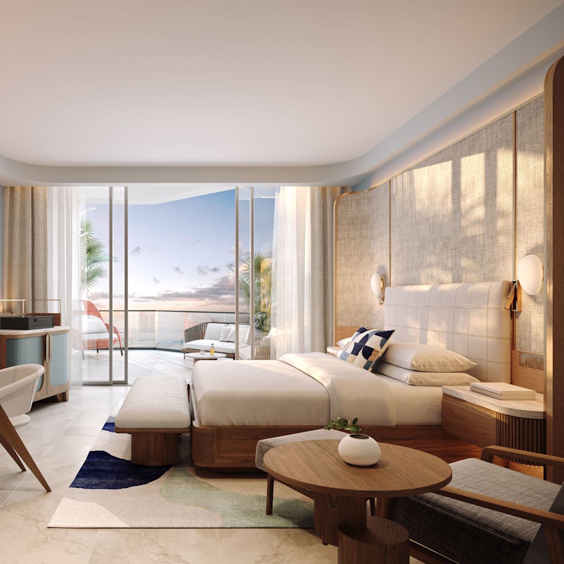 guest room, 1 king bed, work desk, tv, lounge chair, balcony view of the water-transition