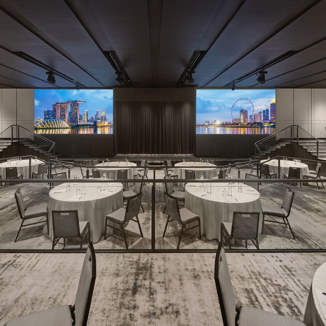ballroom with round tables and city view-transition