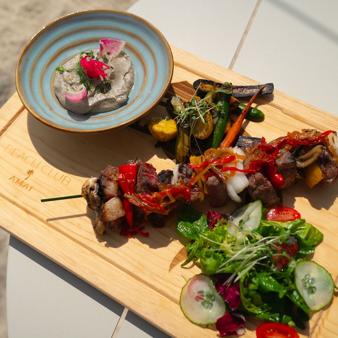 AMAI Beach Club with food image-transition