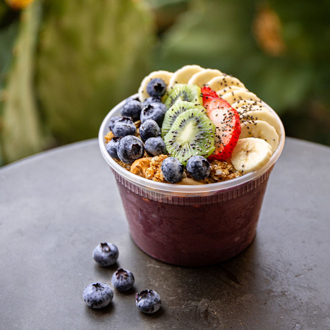 Fresh Berries, Kiwi and Bananas on a Cup at Quenche Juicery-transition