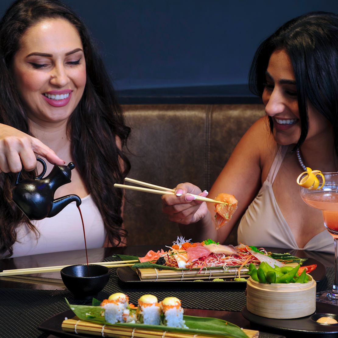 women sitting at table-transition