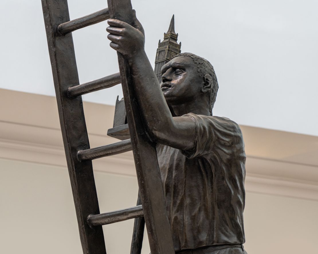 Statue of a Man Climbing a ladder-transition
