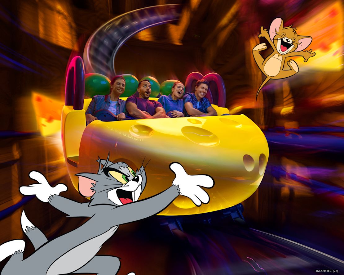 a group of people on a ride at Warner Bros World-transition