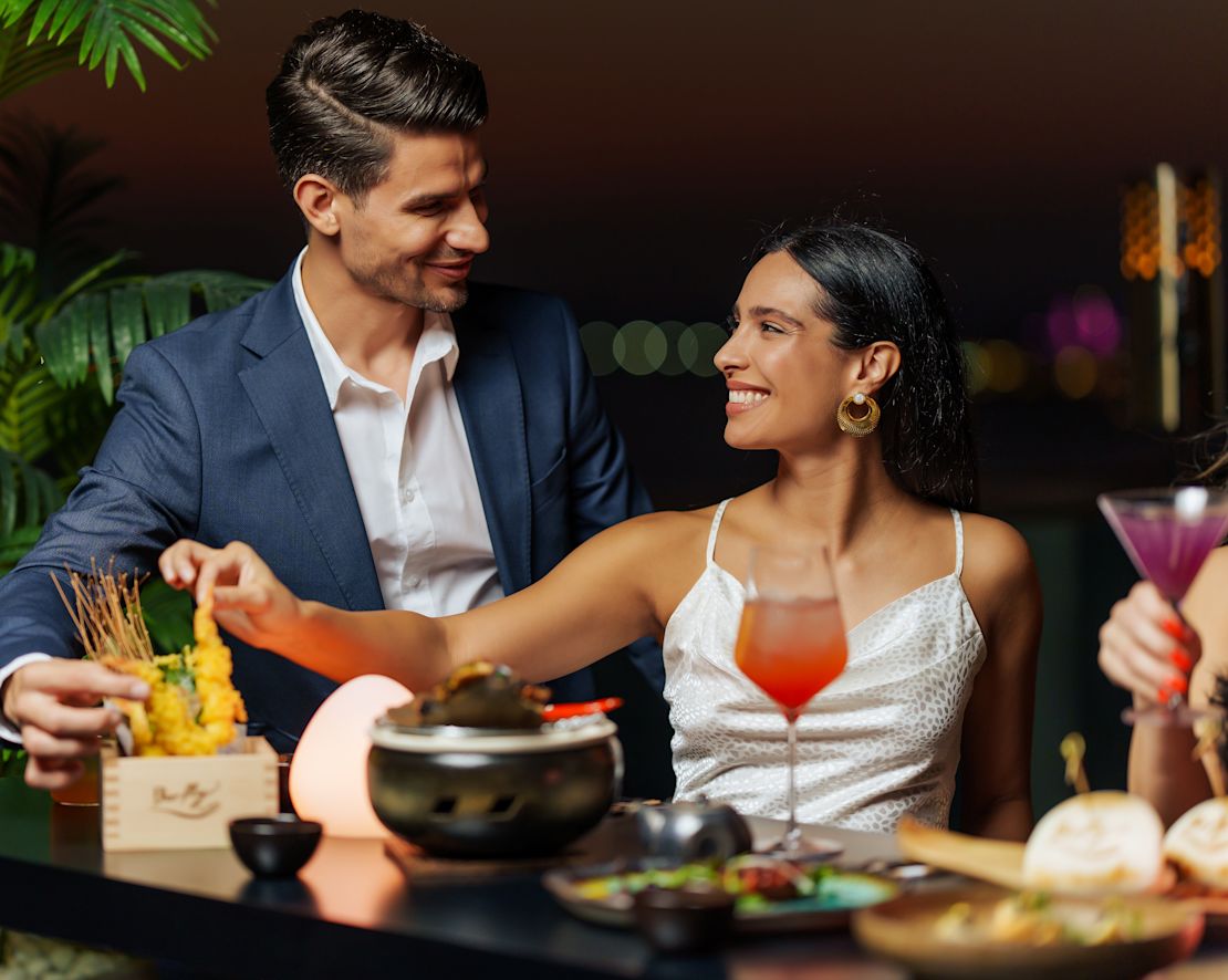 couple at bar with cocktails-transition