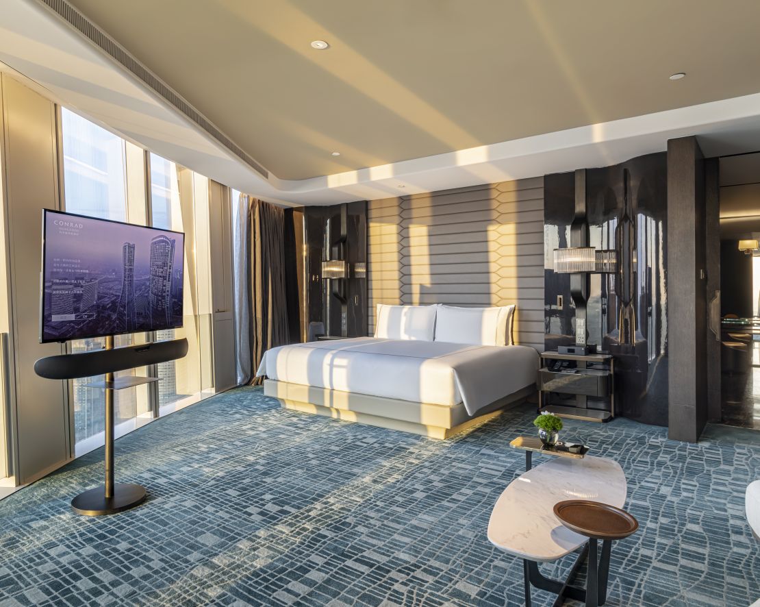 Bedroom with bed, table and view from window-transition