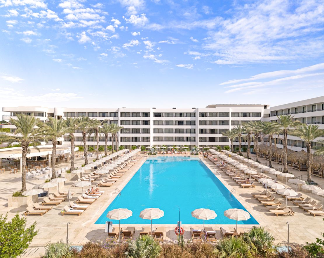 Outdoor Pool with Lounge Chairs and Palm Trees