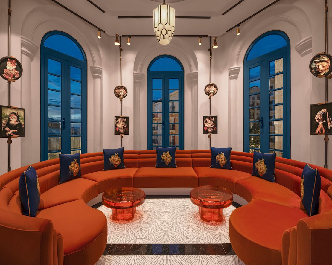 7 Seat Sectional Red Sofa, and Three Bay Windows in Seating Area of Francesca Restaurant-previous-transition