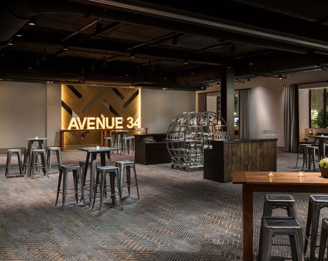 Avenue 34 meeting room with tables and chairs-transition