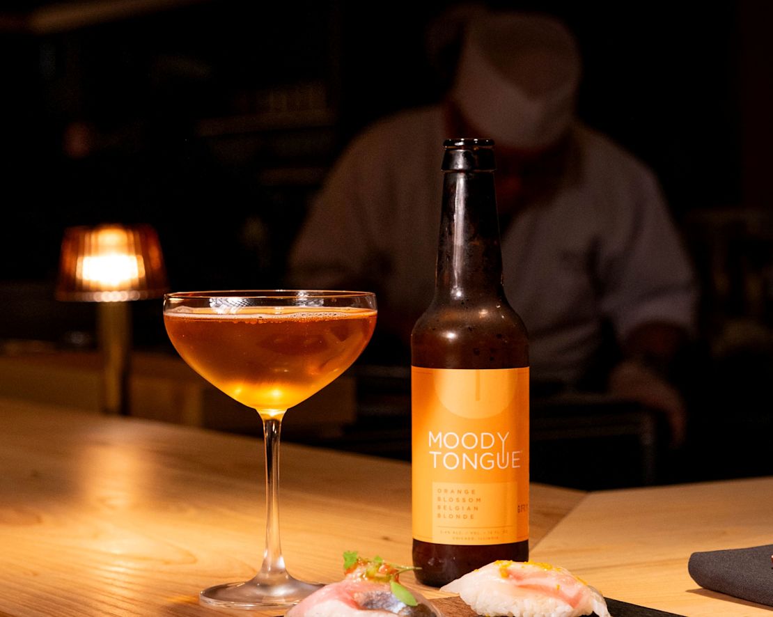 Sushi and a Drink on a Table at Moody Tongue Sushi Restaurant-transition