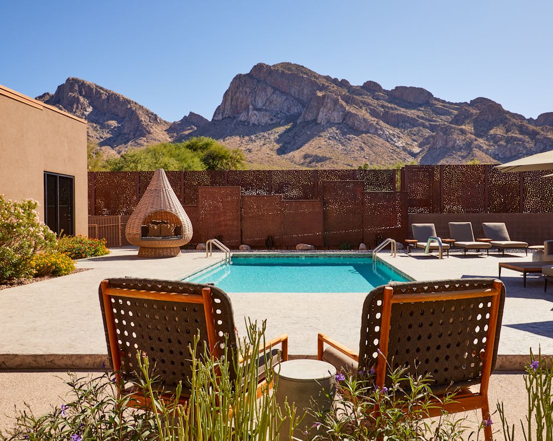 Outdoor Pool with Lounge Chairs and Sitting Area at SpaWell-transition