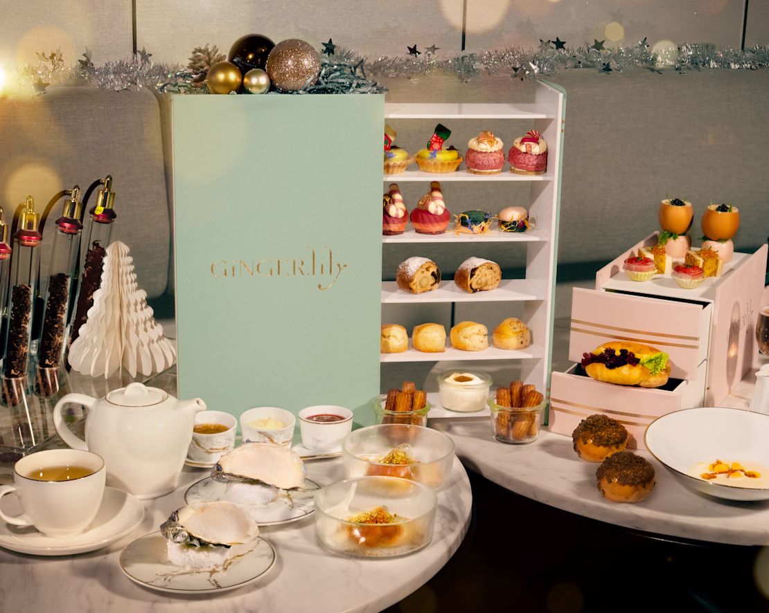 Ginger.Lily Festive Afternoon Tea tea setting with pastries and holiday decorations-transition