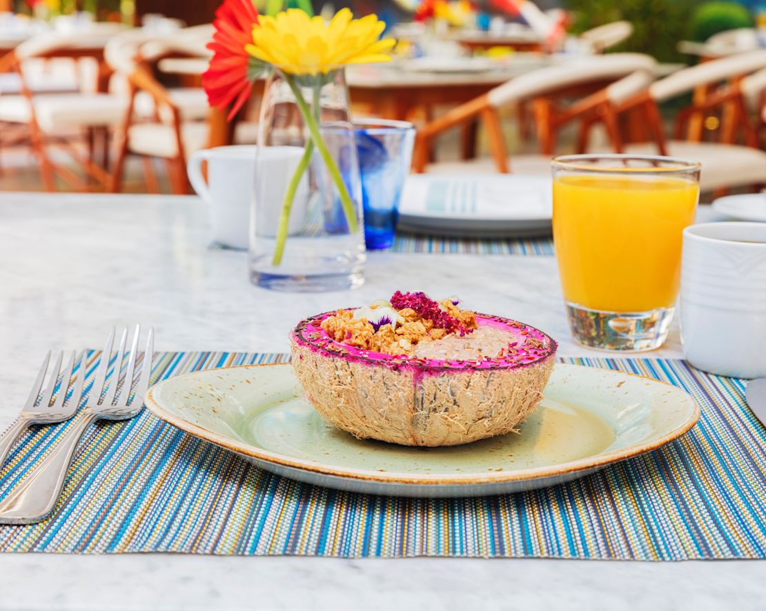 Breakfast food item and orange juice on dining table-transition