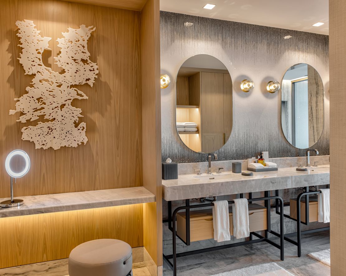 Deluxe suite batheoom with two vanity mirrors and two sinks-previous-transition