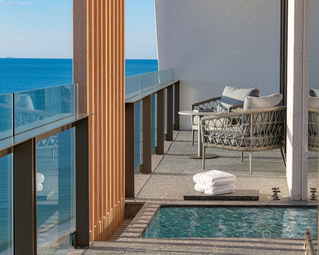 Guest room balcony with chairs-next-transition