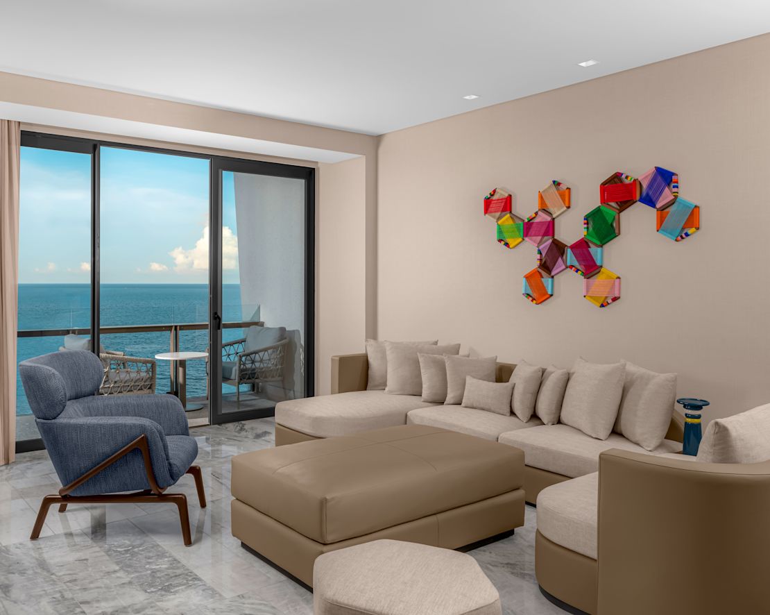 Deluxe ocean front suite living room with sofa and chair-next-transition