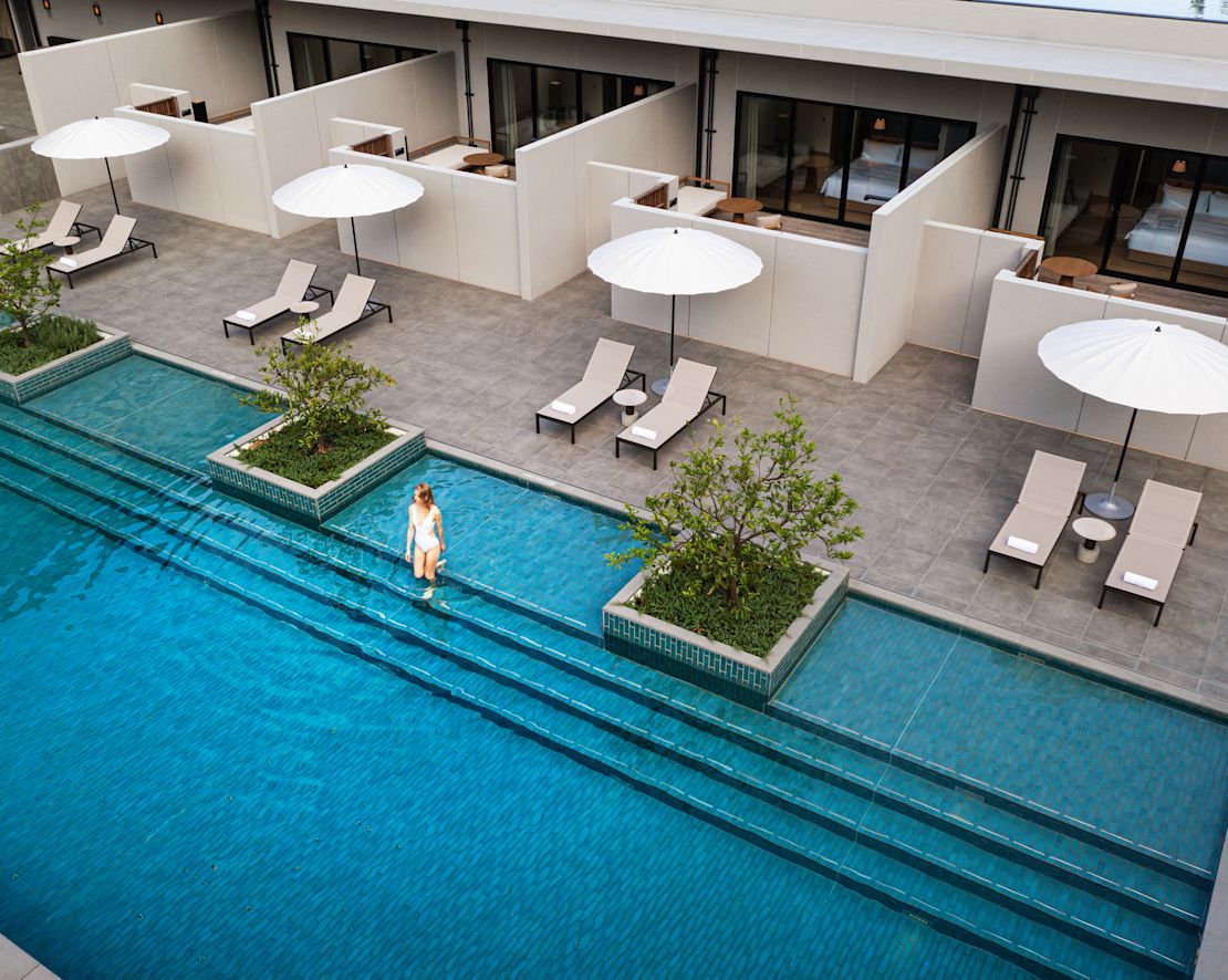 Outdoor pool with model and loungers-transition