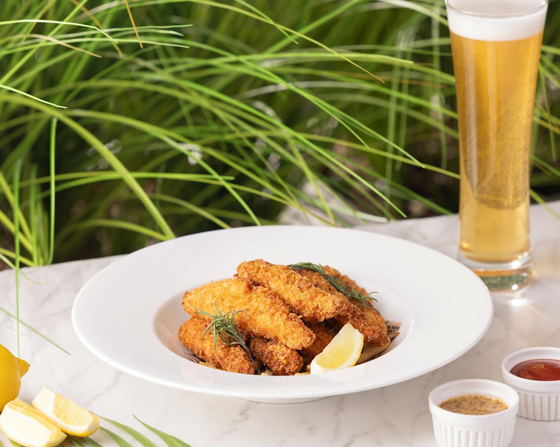 Fried Fish with Lemon Slices, Sauces and a Glass of Beer on a Table-transition