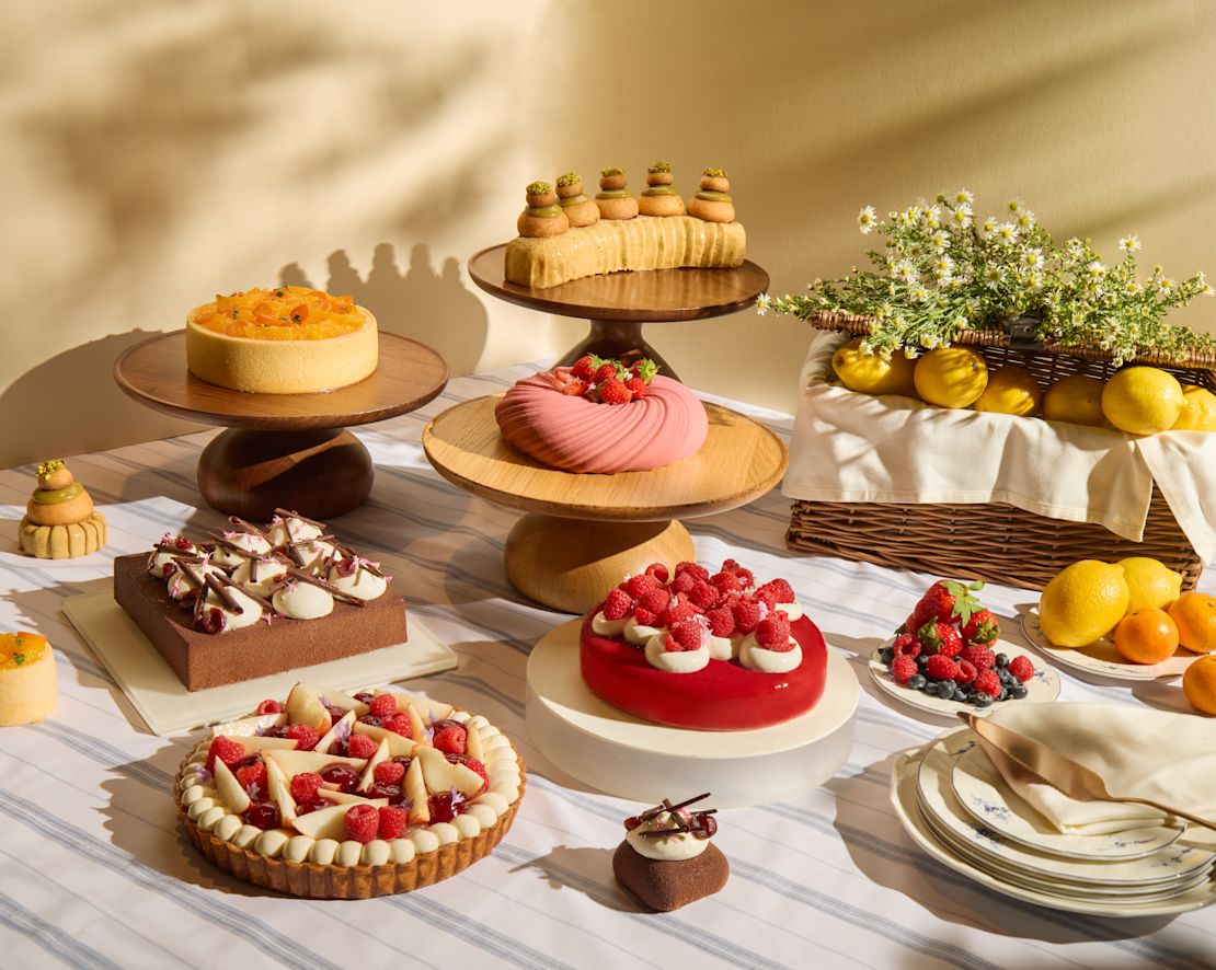 Fresh Citrus Fruits, Cakes and Sweet Desserts on a Table at Ginger.Lily-transition