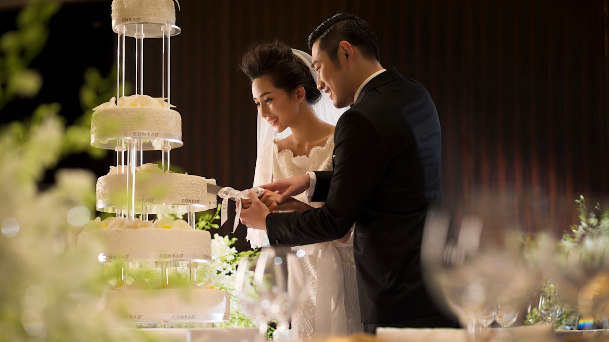 Bride and Groom cutting the wedding cake
