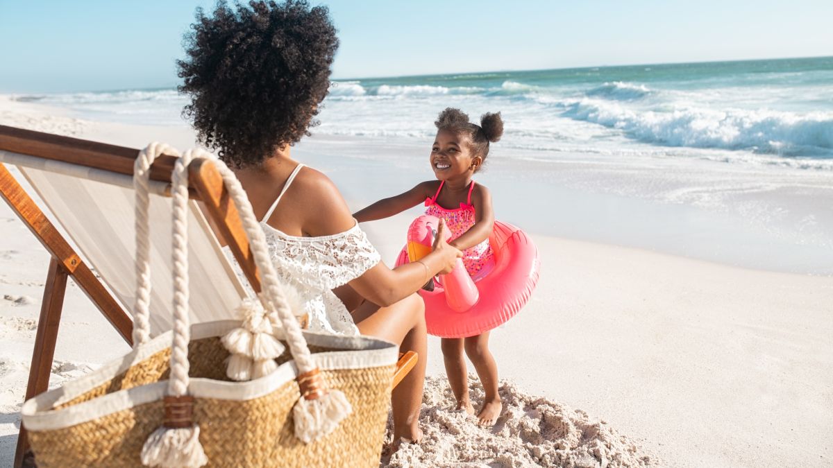 Mother and Daughter Having Fun at the Beach