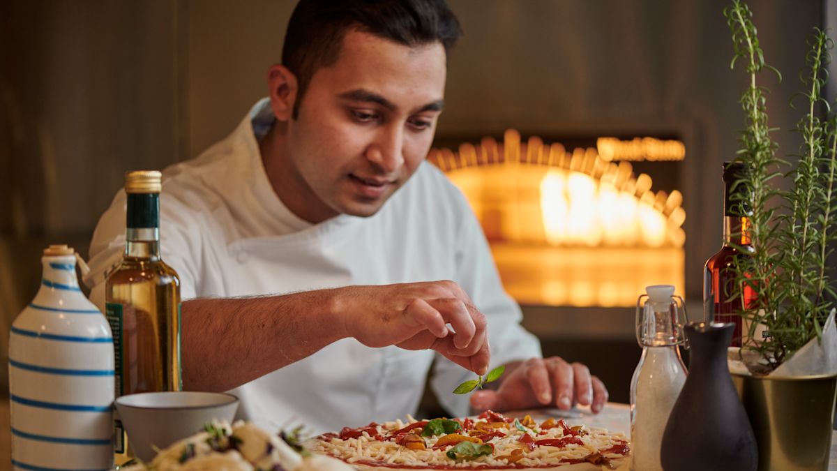 Chef working on pizza