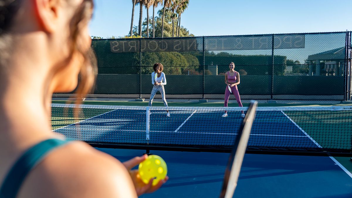 women playing pickleball