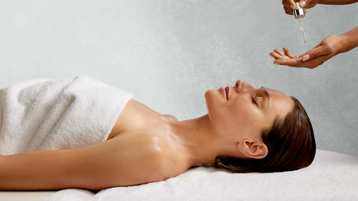 Woman Enjoying a Facial at the Spa 