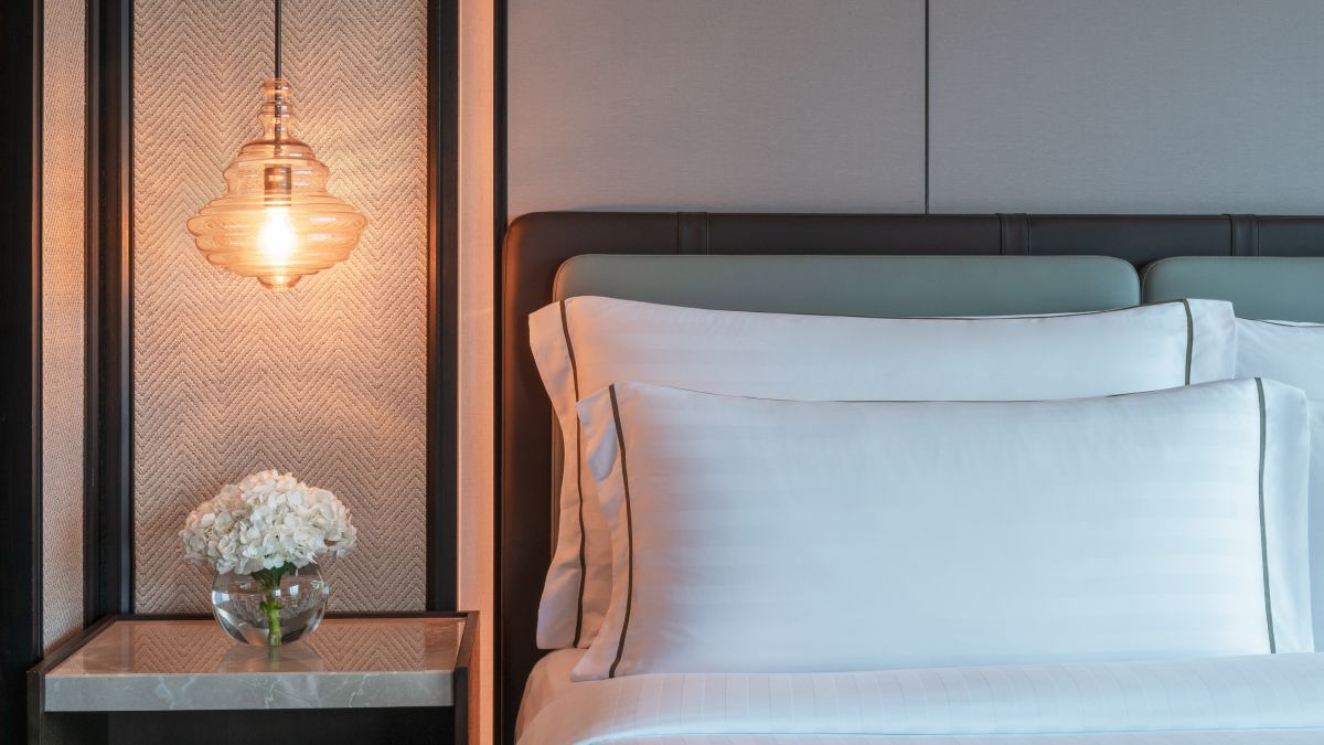 details of pillows on bed and nightstands