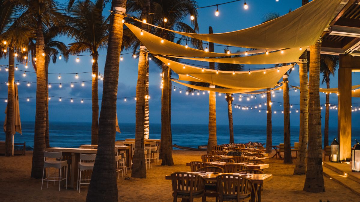 outdoor dining area by the beach at night