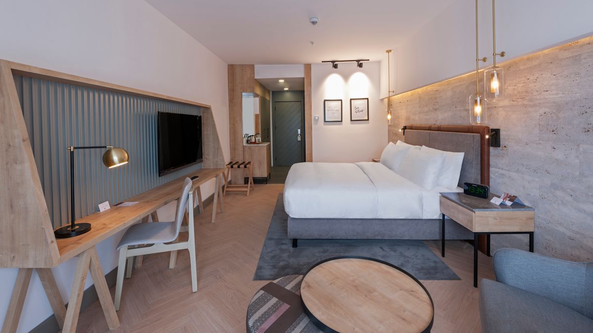 Room with Bed, TV, and Work Desk
