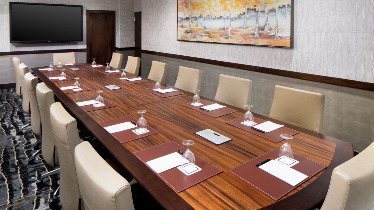 Executive Boardroom Setup for a Meeting with Fourteen Guests