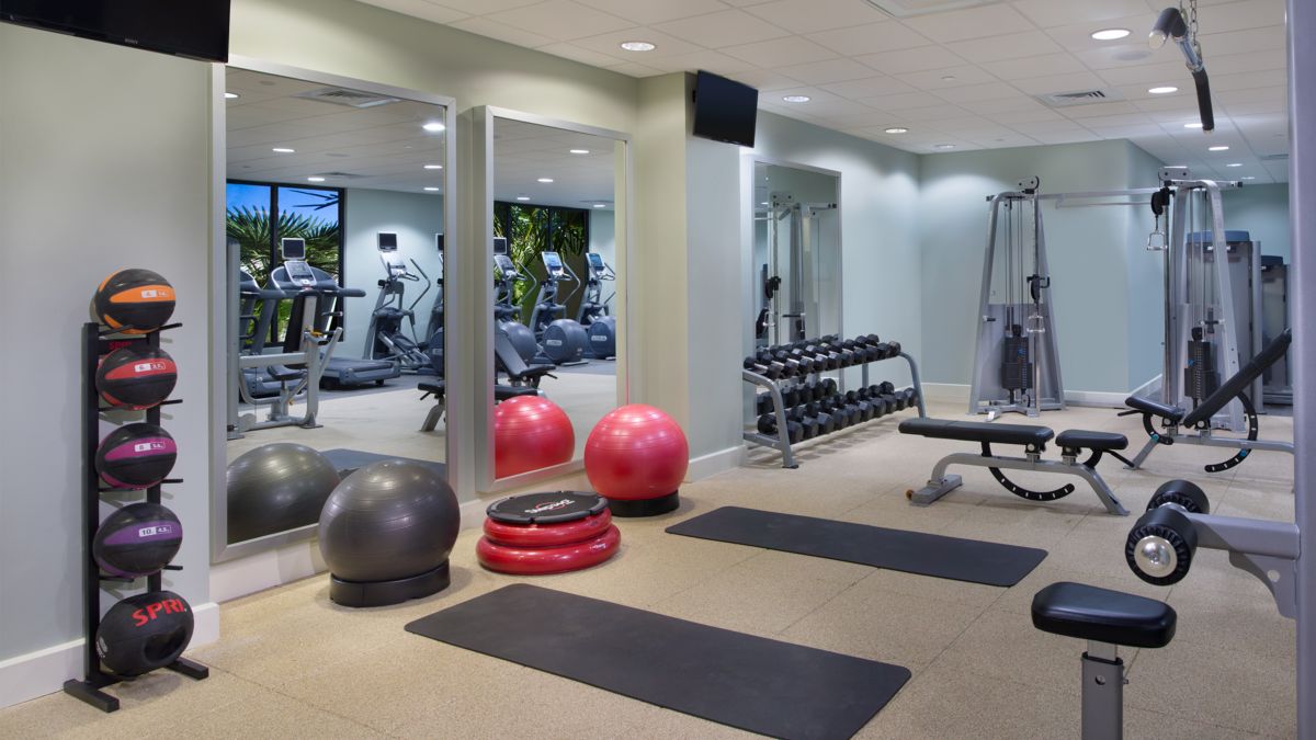Fitness center with resistance machines and mirrors