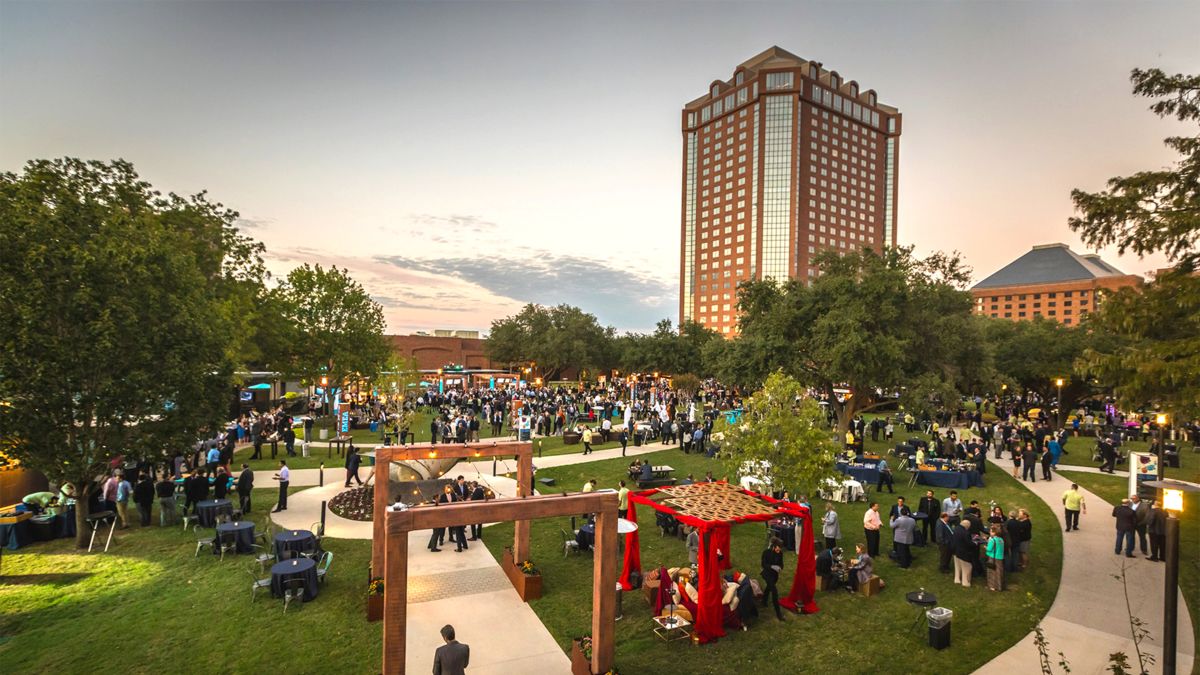 aerial view of outdoor lawn space with guests attending an event