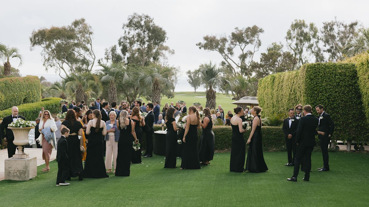 wedding guests standing in garden